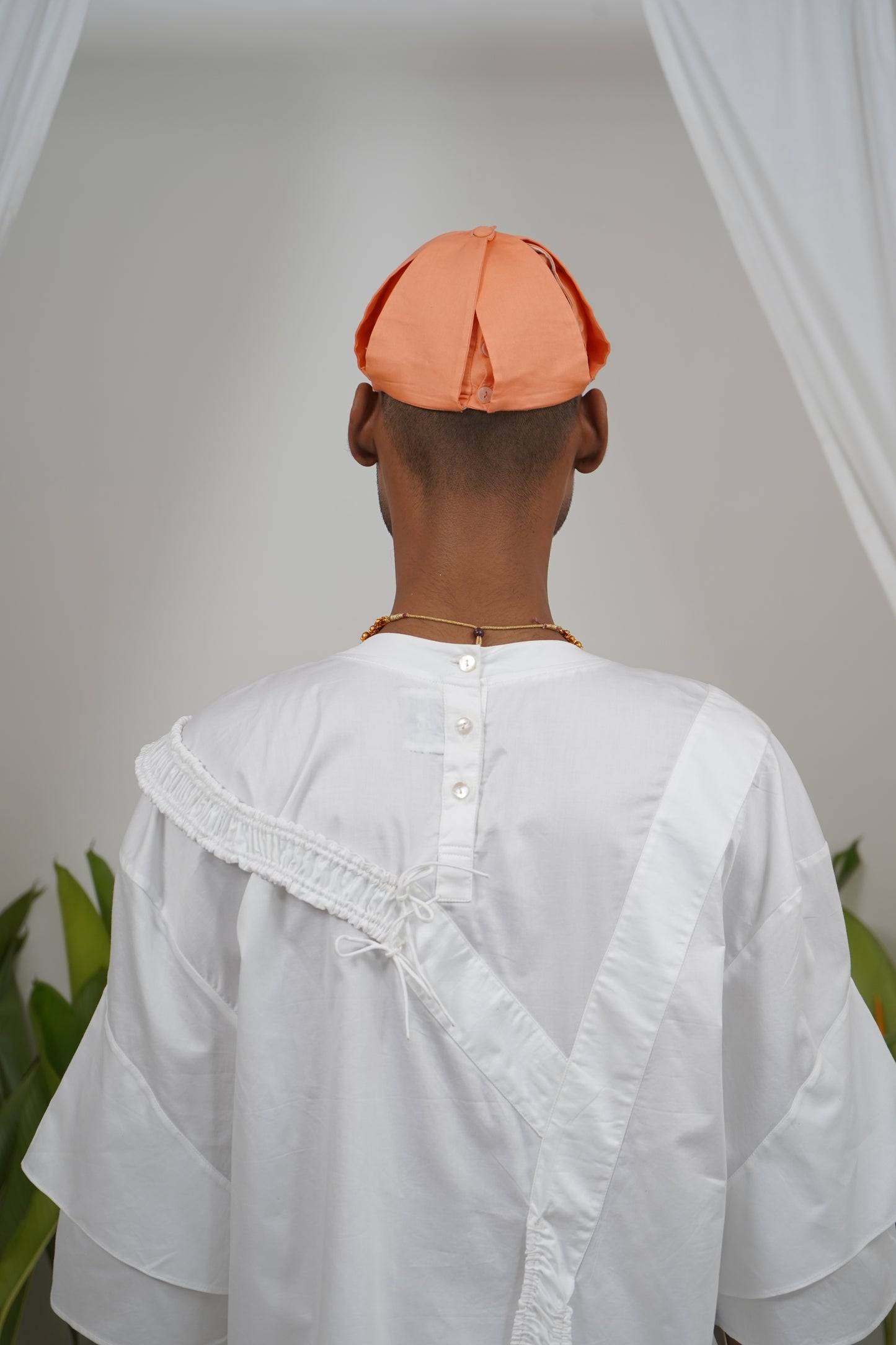 Deconstructable buttoned placket panel cap